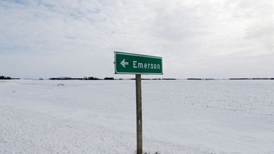 A sign post for the small border town of Emerson near the Canada-US border crossing in Emerson, Manitoba. (Reuters)