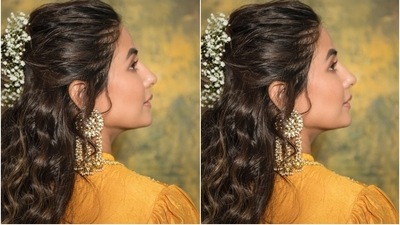 The 34-year-old took her ethnic look up a notch by going for statement accessories. She chose heavy pearl and gold adorned chandelier-styled earrings and a dainty nose pin. In the end, the star tied her locks in a messy half-tied hairdo adorned with a floral hair accessory. (Instagram/@realhinakhan) The 34-year-old took her ethnic look up a notch by going for statement accessories. She chose heavy pearl and gold adorned chandelier-styled earrings and a dainty nose pin. In the end, the star tied her locks in a messy half-tied hairdo adorned with a floral hair accessory. (Instagram/@realhinakhan)
