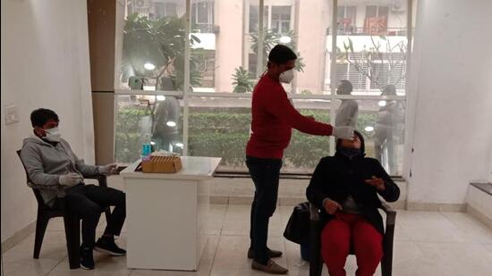 A health worker collects swab samples of a woman for Covid testing, in Greater Noida on Friday. (Sourced)