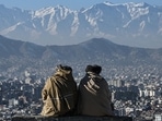 Members of the Taliban sit overlooking the Kabul city at the Wazir Akbar Khan hill in Kabul. Members of the Taliban sit overlooking the Kabul city at the Wazir Akbar Khan hill in Kabul.