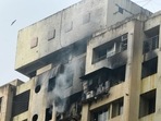 Most of the 400 residents in the building were able to rush out soon after the fire broke out, even as thick smoke filled the passageways.(PTI) Most of the 400 residents in the building were able to rush out soon after the fire broke out, even as thick smoke filled the passageways.(PTI)