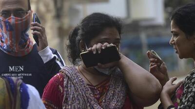 Residents from Kamala building were evacuated to the adjacent building after the massive fire broke out in Tardeo, Mumbai on Saturday. (Anshuman Poyrekar/HT) Residents from Kamala building were evacuated to the adjacent building after the massive fire broke out in Tardeo, Mumbai on Saturday. (Anshuman Poyrekar/HT)