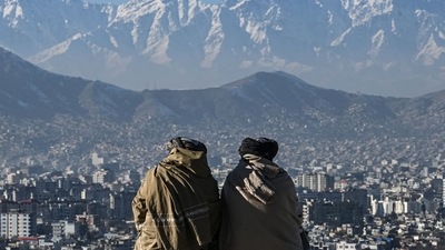Members of the Taliban sit overlooking the Kabul city at the Wazir Akbar Khan hill in Kabul. (AFP) Members of the Taliban sit overlooking the Kabul city at the Wazir Akbar Khan hill in Kabul. (AFP)