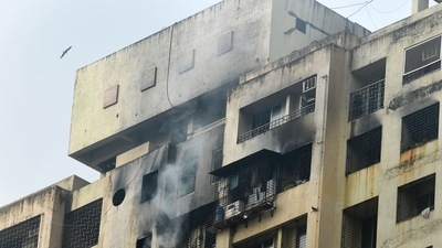 Most of the 400 residents in the building were able to rush out soon after the fire broke out, even as thick smoke filled the passageways. (PTI) Most of the 400 residents in the building were able to rush out soon after the fire broke out, even as thick smoke filled the passageways. (PTI)