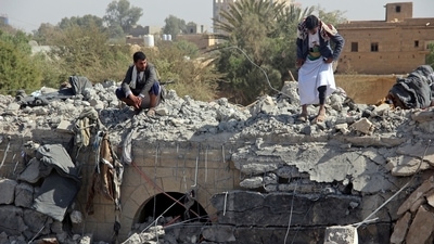 Yemenis inspect the damage a day after a reported Saudi-led airstrike targeting a prison in the Huthi stronghold of Saada in northern Yemen. (AFP)