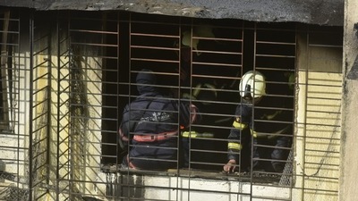 Fire brigade personnel carry out cooling operation after a blaze gutted a flat in Kamala building at Tardeo in Mumbai on Saturday. (Anshuman Poyrekar/HT Photo) Fire brigade personnel carry out cooling operation after a blaze gutted a flat in Kamala building at Tardeo in Mumbai on Saturday. (Anshuman Poyrekar/HT Photo)
