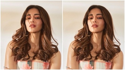 Ananya, for the weekend promotions, picked an orange and black checkered floral corset top. The top came with off-shoulders and knot details at the sides. Ananya paired it with a neutral grey pair of shorts. (Instagram/@ananyapanday)