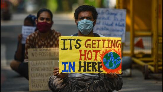 Activists with placards take part in a protest against climate change outside the Ministry of Environment in New Delhi earlier. The environment ministry has started implementing most of the TSR Subramaniam committee recommendations to create a single-window environment, forest and coastal regulation clearance system. (Image used for representation). (Amal KS/HT PHOTO.) Activists with placards take part in a protest against climate change outside the Ministry of Environment in New Delhi earlier. The environment ministry has started implementing most of the TSR Subramaniam committee recommendations to create a single-window environment, forest and coastal regulation clearance system. (Image used for representation). (Amal KS/HT PHOTO.)