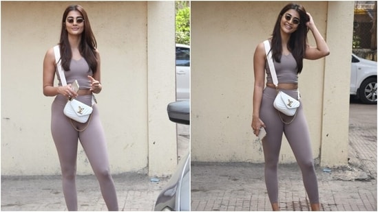 Today, the paparazzi clicked Pooja coming out of her Pilates class after a workout routine. The star posed and smiled for the cameras outside the studio. She looked stunning in her monotone gym outfit, flaunting an after-workout glow.(HT Photo/Varinder Chawla)