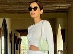 Manushi Chhillar chills in Oman wearing <span class='webrupee'>₹</span>7k crop top and thigh-slit skirt: Can you guess the bag's price?