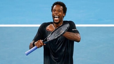 Gael Monfils of France celebrates after defeating Miomir Kecmanovic of Serbia in their fourth round match at the Australian Open tennis championships in Melbourne, Australia, Sunday, Jan. 23, 2022 (AP)