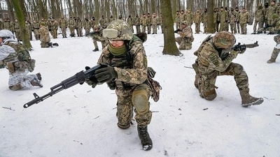 Members of Ukraine’s Territorial Defence Forces, volunteer military units of the Armed Forces, train in a city park in Kiev. (AP)