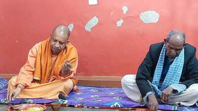 Uttar Pradesh chief minister Yogi Adityanath have lunch at the residence of Amritlal Bharti, in Gorakhpur, on January 15, 2021. (ANI photo) Uttar Pradesh chief minister Yogi Adityanath have lunch at the residence of Amritlal Bharti, in Gorakhpur, on January 15, 2021. (ANI photo)