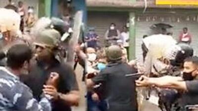 Video footage captured by local television channels showed one of Arjun Singh’s security personnel loading a pistol and pointing it at some people who confronted the MP, but police said the allegations of firing were being probed but there was no evidence of any clash or ransacking. (SCREENGRAB.) Video footage captured by local television channels showed one of Arjun Singh’s security personnel loading a pistol and pointing it at some people who confronted the MP, but police said the allegations of firing were being probed but there was no evidence of any clash or ransacking. (SCREENGRAB.)