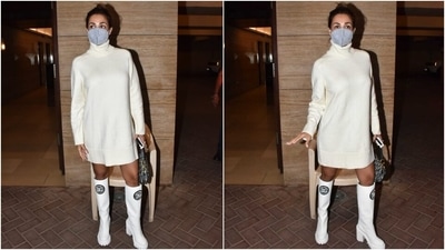 Malaika wore a sweater dress in a pearl white shade for the outing. Her knit ensemble features a turtle neckline, full sleeves, ribbed details on the raised neck, cuffs and hem, a figure-skimming silhouette and a mini length that gave a glimpse of her legs. (HT Photo/Varinder Chawla) Malaika wore a sweater dress in a pearl white shade for the outing. Her knit ensemble features a turtle neckline, full sleeves, ribbed details on the raised neck, cuffs and hem, a figure-skimming silhouette and a mini length that gave a glimpse of her legs. (HT Photo/Varinder Chawla)