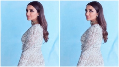 The set came with a short kurti, intricately designed in silver beads. She paired the midriff-baring kurti with a pair of white sharara embellished in silver resham threads. (Instagram/@parineetichopra)
