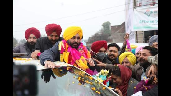 AAP’s CM face Bhagwant Mann holding a roadshow at a Sangrur village on Sunday.