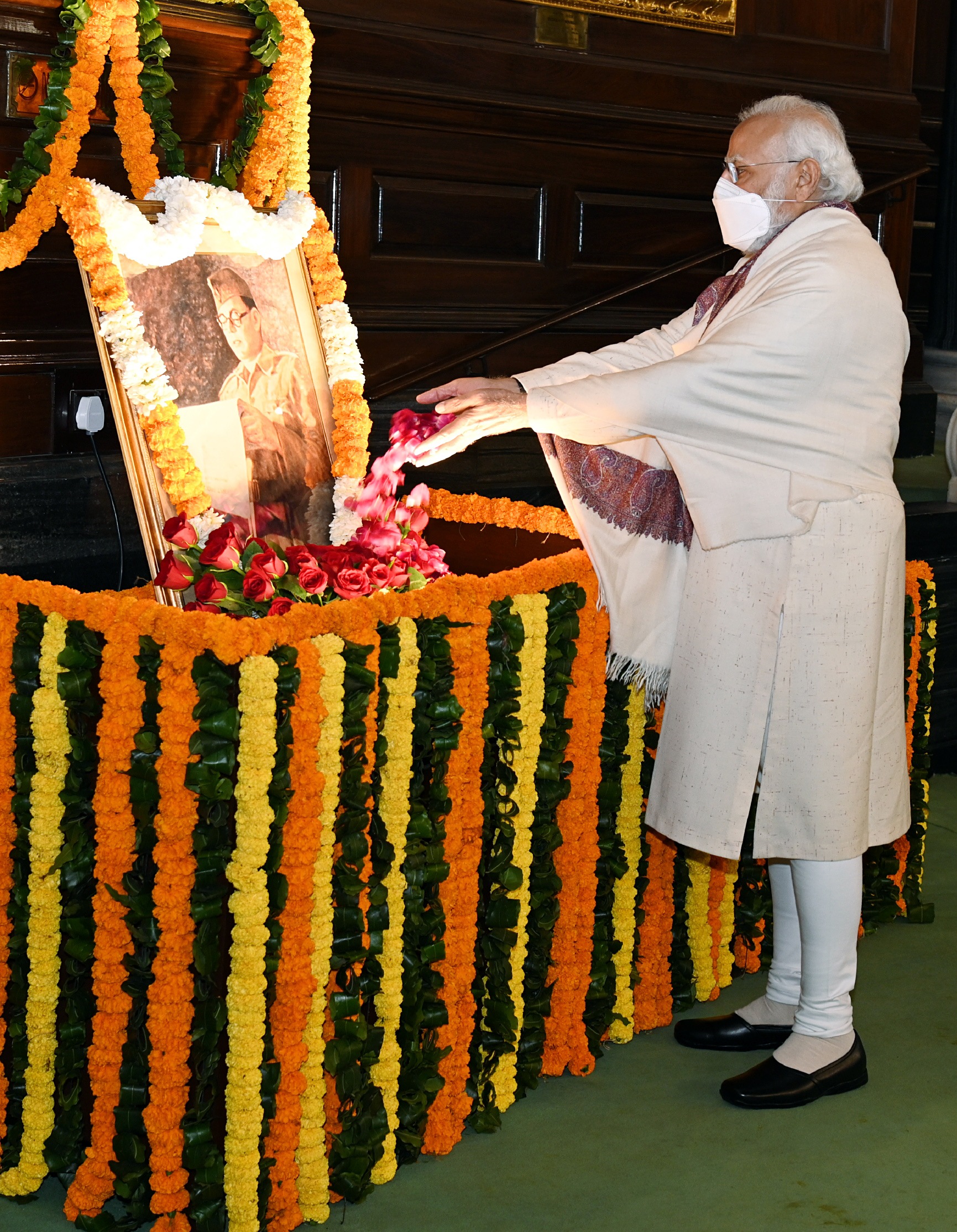 Prime Minister Narendra Modi pays floral tribute to the portrait of Netaji Subhas Chandra Bose on his 125th birth anniversary, at the Central Hall of Parliament, in New Delhi. (ANI Photo) Prime Minister Narendra Modi pays floral tribute to the portrait of Netaji Subhas Chandra Bose on his 125th birth anniversary, at the Central Hall of Parliament, in New Delhi. (ANI Photo)