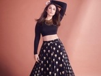 Effortlessly oozing oomph this winters, Bollywood actor Parineeti Chopra set the Internet on fire and her pictures from a recent photoshoot are to be blamed as she slew a figure defining silhouette in a full sleeves crop top with gold foil print skirt.  (Instagram/parineetichopra)