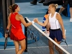 Estonia's Kaia Kanepi and Belarus' Aryna Sabalenka shake hands after their fourth round match