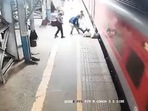 RPF personnel save the man, who fell on the platform while attempting to board the moving train at the Vasai Railway Station in Maharashtra. (Screengrab/ANI) RPF personnel save the man, who fell on the platform while attempting to board the moving train at the Vasai Railway Station in Maharashtra. (Screengrab/ANI)