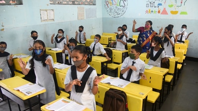 On Monday morning, Maharashtra School Education Minister Varsha Gaikwad greeted students and parents on the reopening of physical classes. "Wishing all parents and students the very best as physical classes reopen today onwards. We hope you enjoy your day back in a safe atmosphere. #BackToSchool. @scertmaha @CMOMaharashtra @msbshse," Gaikwad tweeted. (HT Photo/Vijay Bate)