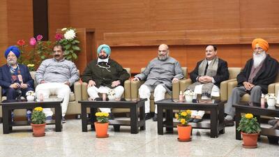 Union minister Amit Shah with Punjab Lok Congress party leader Captain Amarinder Singh, BJP president JP Nadda and Shiromani Akali Dal (Sankyukt) S.S. Dhindsa during a meeting at BJP headquarters, in New Delhi, on Monday. The party released its first list of candidates for the upcoming assembly elections on Monday. (HT photo/Arvind Yadav) Union minister Amit Shah with Punjab Lok Congress party leader Captain Amarinder Singh, BJP president JP Nadda and Shiromani Akali Dal (Sankyukt) S.S. Dhindsa during a meeting at BJP headquarters, in New Delhi, on Monday. The party released its first list of candidates for the upcoming assembly elections on Monday. (HT photo/Arvind Yadav)