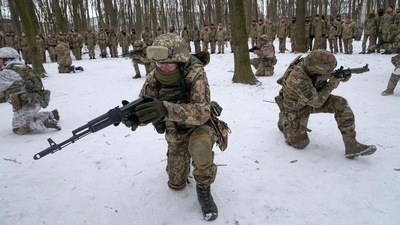 Members of Ukraine's Territorial Defense Forces, volunteer military units of the Armed Forces, train in a city park in Kyiv, Ukraine. (AP) Members of Ukraine's Territorial Defense Forces, volunteer military units of the Armed Forces, train in a city park in Kyiv, Ukraine. (AP)