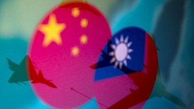 Chinese and Taiwanese national flags are displayed alongside military airplanes in this illustration. (REUTERS)