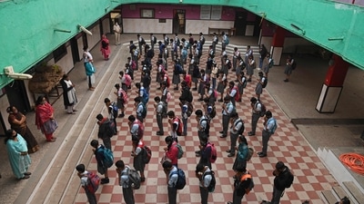 Students pray during their morning assembly at a school in Mumbai after schools, that were closed to prevent the spread of coronavirus, reopened on January 24. (AFP) Students pray during their morning assembly at a school in Mumbai after schools, that were closed to prevent the spread of coronavirus, reopened on January 24. (AFP)
