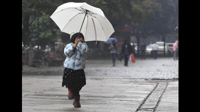 A girl enjoying the rain at the Sector 17 Plaza in Chandigarh on Sunday. (Keshav Singh/HT) A girl enjoying the rain at the Sector 17 Plaza in Chandigarh on Sunday. (Keshav Singh/HT)