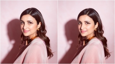 Parineeti channelled her inner retro queen wearing a contemporary blush pink saree. She captioned the post, "Cast me in a retro movie?" The six yards the actor wore in the photoshoot is from the shelves of the clothing label, Faabiiana. Additionally, celebrity stylist Tanya Ghavri, who has worked with stars like Kareena Kapoor Khan, Sara Ali Khan, Janhvi Kapoor and more, styled the star's look. (Instagram/@parineetichopra) Parineeti channelled her inner retro queen wearing a contemporary blush pink saree. She captioned the post, "Cast me in a retro movie?" The six yards the actor wore in the photoshoot is from the shelves of the clothing label, Faabiiana. Additionally, celebrity stylist Tanya Ghavri, who has worked with stars like Kareena Kapoor Khan, Sara Ali Khan, Janhvi Kapoor and more, styled the star's look. (Instagram/@parineetichopra)