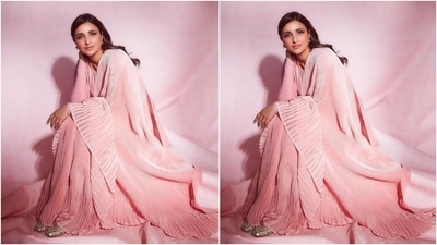 Gold accessories elevated the minimal vibe of the six yards and added a much-needed colour contrast to the look. She wore an ornate gold band necklace, matching swirl-shaped earrings, and a ring. In the end, she rounded off the look with beige and gold mirror-embellished juttis. (Instagram/@parineetichopra) Gold accessories elevated the minimal vibe of the six yards and added a much-needed colour contrast to the look. She wore an ornate gold band necklace, matching swirl-shaped earrings, and a ring. In the end, she rounded off the look with beige and gold mirror-embellished juttis. (Instagram/@parineetichopra)