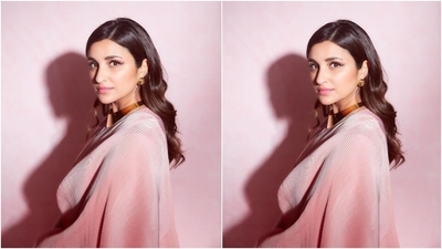 Parineeti chose side parted open tresses, styled in soft waves and set in a sleeked back style for her hairdo. Glossy pink lip shade, bold winged eyeliner, mascara-laden lashes, blushed cheeks, and a good amount of highlighter on the skin rounded off the glam picks. (Instagram/@parineetichopra) Parineeti chose side parted open tresses, styled in soft waves and set in a sleeked back style for her hairdo. Glossy pink lip shade, bold winged eyeliner, mascara-laden lashes, blushed cheeks, and a good amount of highlighter on the skin rounded off the glam picks. (Instagram/@parineetichopra)