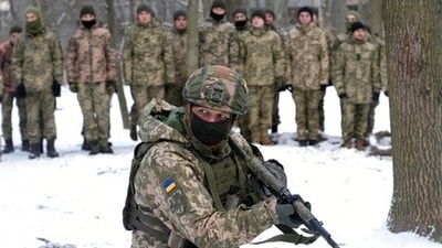 An instructor trains members of Ukraine's Territorial Defense Forces, volunteer military units of the country's armed forces, in Kyiv. (AP Photo) An instructor trains members of Ukraine's Territorial Defense Forces, volunteer military units of the country's armed forces, in Kyiv. (AP Photo)