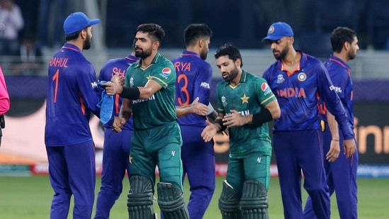 Pakistan's Mohammad Rizwan and Babar Azam shake hands with the India players after the match in ICC T20 World Cup 2021(REUTERS)