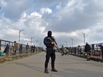 Security personnel cordoned off the area after militants hurled grenades on the eve of Republic Day at Harisingh high street in Srinagar on Tuesday. Security personnel cordoned off the area after militants hurled grenades on the eve of Republic Day at Harisingh high street in Srinagar on Tuesday. 