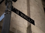A general view shows a Wall Street sign outside the New York Stock Exchange (NYSE).(AFP Photo) A general view shows a Wall Street sign outside the New York Stock Exchange (NYSE).(AFP Photo)