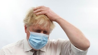 Britain's Prime Minister Boris Johnson gestures during a visit to Finchley Memorial Hospital, in North London, Tuesday, Jan. 18, 2022.&nbsp; (File Photo / AP)