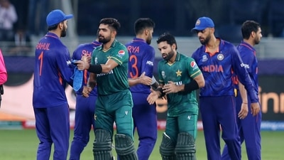 Pakistan's Mohammad Rizwan and Babar Azam shake hands with the India players after the match. (REUTERS)