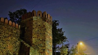 The top of the stone gateway is punctuated with large tablets of stone, which are separated from each other by vertical slits through which the warriors of old times must have aimed their guns, or spears, at the barbarians gathered outside the gate.