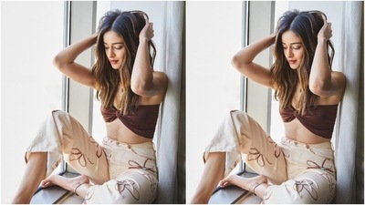 Earlier today, Ananya Panday shared a couple of photos of herself in a rustic coloured tube top and flared printed pants. (Instagram/@ananyapanday) Earlier today, Ananya Panday shared a couple of photos of herself in a rustic coloured tube top and flared printed pants. (Instagram/@ananyapanday)