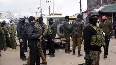 Security personnel cordon off the area after terrorists hurled grenade on the eve of Republic Day at Hari Singh High Street, in Srinagar on Tuesday. (ANI)