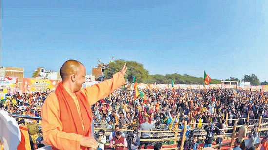 Chief minister Yogi Adityanath waves towards supporters during the inauguration of BJP's 'Jan Vishwas Yatra' in Mathura, ahead of the 2022 UP elections, on December 19. (PTI) Chief minister Yogi Adityanath waves towards supporters during the inauguration of BJP's 'Jan Vishwas Yatra' in Mathura, ahead of the 2022 UP elections, on December 19. (PTI)