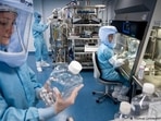 BioNTech employees in cleanroom suits test the procedures for the manufacturing of the vaccine(Thomas Lohnes/AFP/Getty Images) BioNTech employees in cleanroom suits test the procedures for the manufacturing of the vaccine(Thomas Lohnes/AFP/Getty Images)
