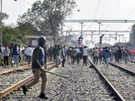Aspirants block railway tracks during their protest over Railways NTPC exam. (PTI) Aspirants block railway tracks during their protest over Railways NTPC exam. (PTI)