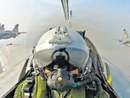 A screengrab shows the view from a cockpit during the 7-aircraft 'Baaz' formation.