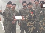 Republic Day 2022 celebrations: BSF, Pakistan Army exchange sweets, greetings at Attari-Wagah border. Republic Day 2022 celebrations: BSF, Pakistan Army exchange sweets, greetings at Attari-Wagah border.