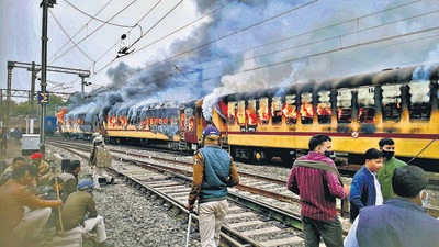 In Bihar, four bogies of an empty train were set on fire on Wednesday while train services were disrupted in many parts for the third successive day, police said. (ANI) In Bihar, four bogies of an empty train were set on fire on Wednesday while train services were disrupted in many parts for the third successive day, police said. (ANI)