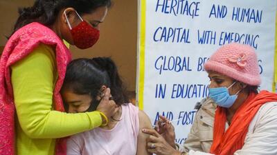 A health worker administers a Covid-19 vaccine to a teenager in Gurugram. On January 15, Haryana health minister Anil Vij announced on social media that unvaccinated children in the 15-18 age group will not be allowed to attend classes offline when schools reopen. (PTI File)